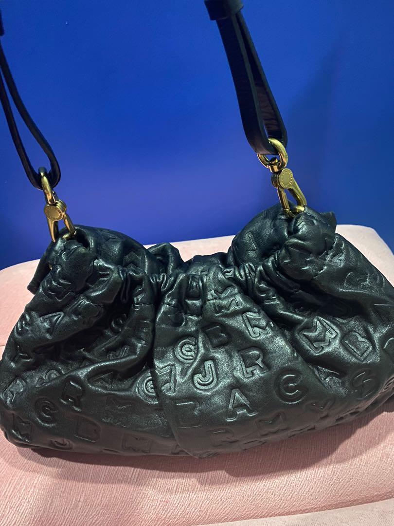 Marc Jacobs Shoulder/Clutch Bag (Category: Luxury Bags & Wallets) located in San Fernando. Submitted by thehamiltonqueen (Listing ID 1121918604, Image 2). Description: Original Marc Jacobs Soft Leather embossed Shoulder/Clutch bag Color:Black Hardware:Matte Gold Inclusion:Bag and its detachable and adjustable strap Signs of Wear: hairline scratches on the from buckle Personal preloved used as clutch bag for formal occasion. Very spacious. MOP: BD