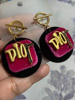 Christian Dior earrings not Prada Gucci