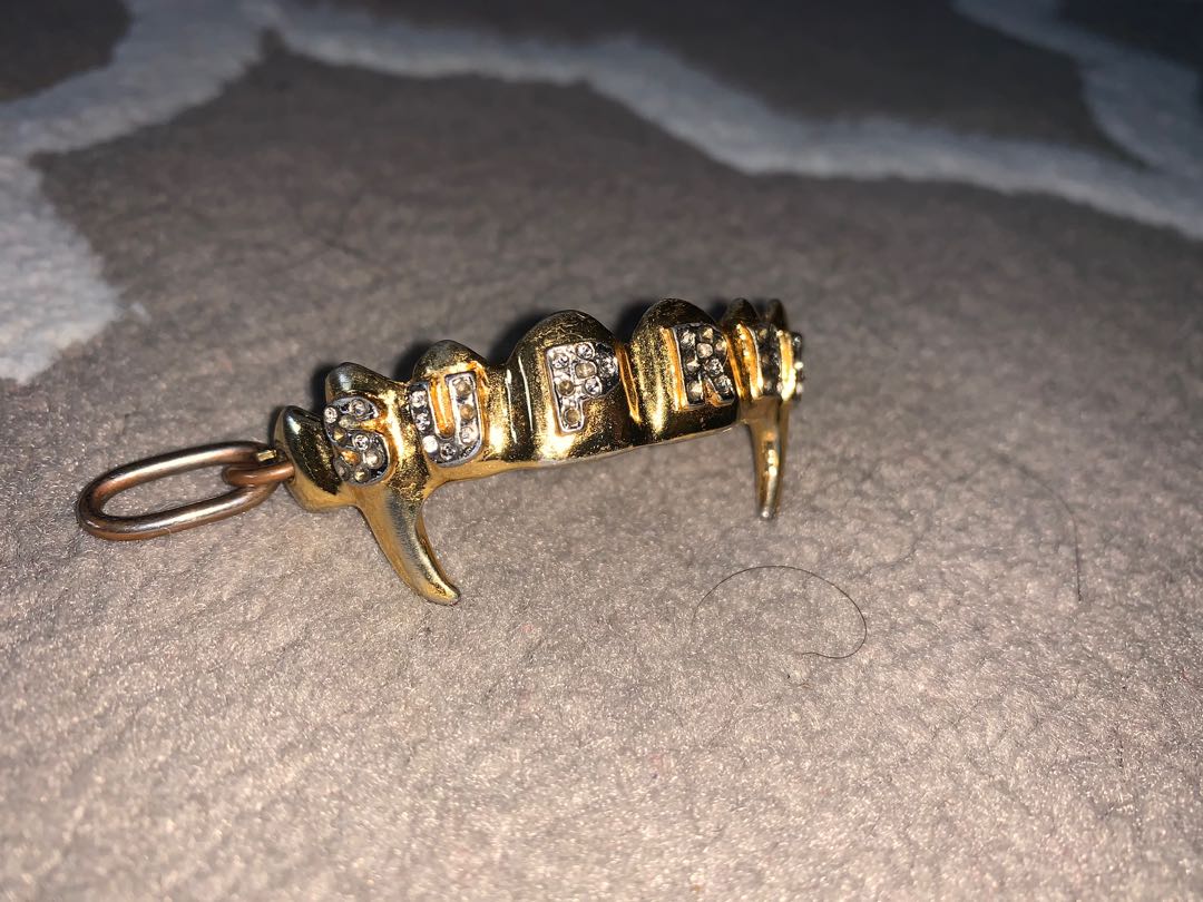 Supreme on sale keychain gold