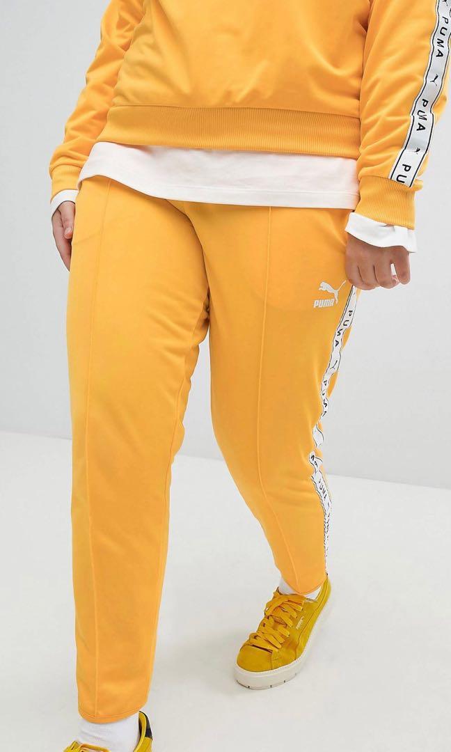 Puma taped side stripe hot sale track pants