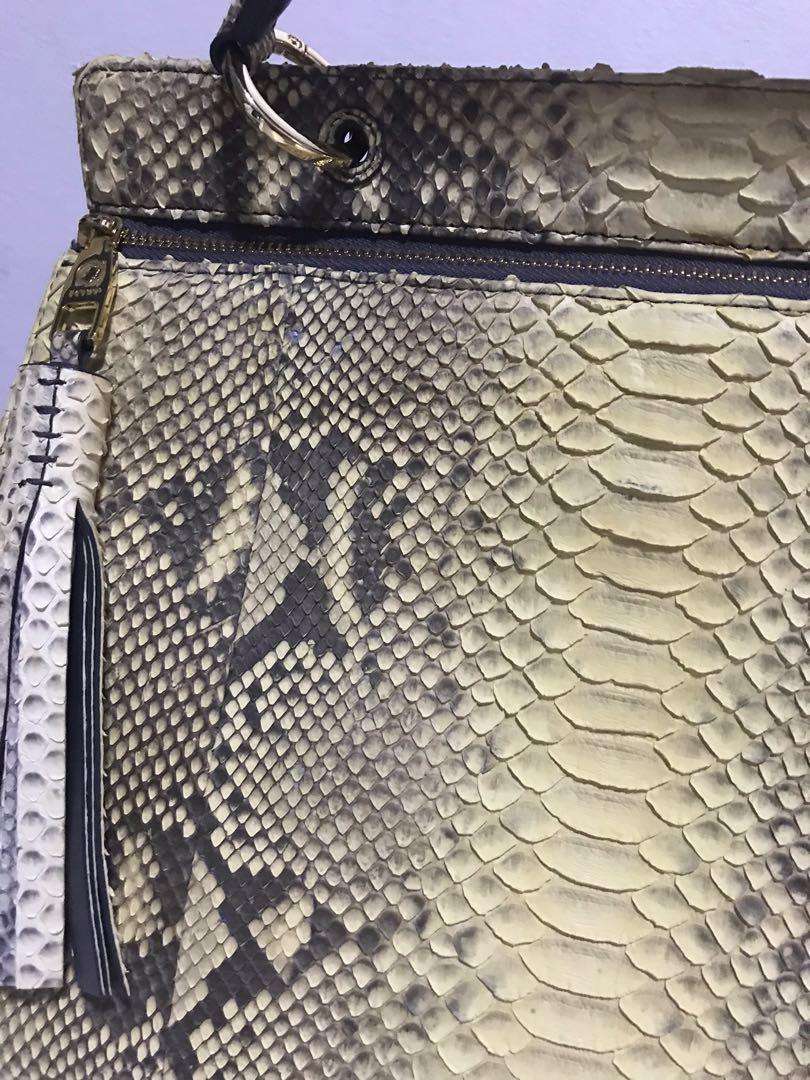 Zarmoi Genuine Python Skin (Category: Luxury Bags & Wallets) located in Valenzuela. Submitted by rebella.ph (Listing ID 1118257144, Image 2). Description: ‼️See the last picture of the flaw.‼️ Exotic snakeskins are delicate and sensitive to harsh light so it’s important to avoid UV and direct sunlight. Overexposure to the elements, hot and cold, will cause the skin to dry out and the scales to lift..