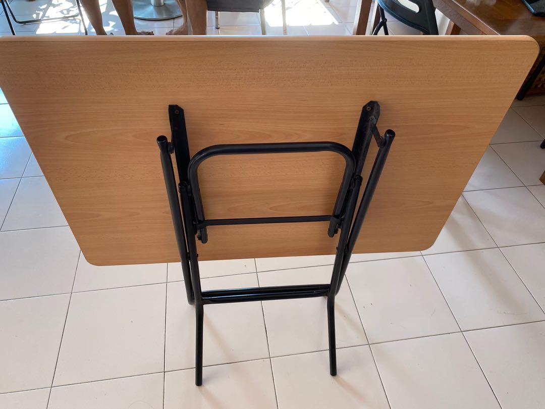 Foldable Table (Category: Tables & Sets) located in Singapore. Submitted by tanlady123 (Listing ID 1118393614, Image 3). Description: Rectangular foldable table hardly used maybe once or twice, kept in store room. Length 90 cm by width 61 cm. When folded, height is 92cm, spread at bottom legs is 29 cm. Self-collect at Blk 117, Bishan St 12. .