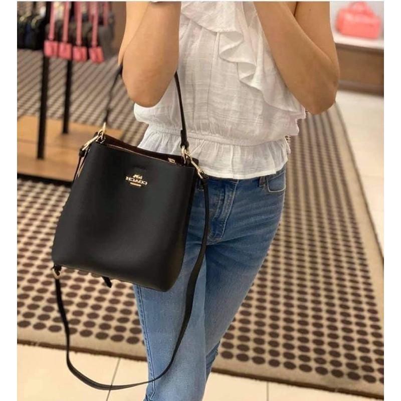 Small coach bucket bag