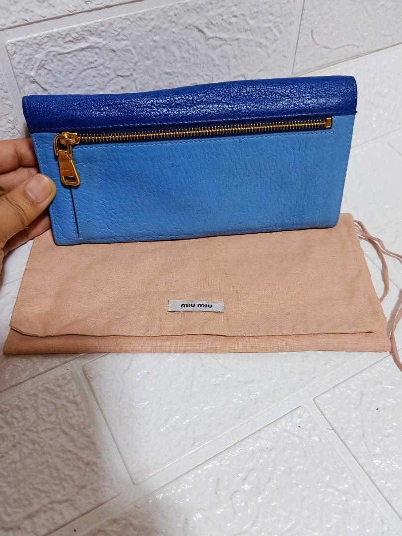 AUTHENTIC MIU MIU MADRAS TWO TONE LONG WALLET (Category: Luxury Bags & Wallets) located in La Trinidad. Submitted by xef06 (Listing ID 1123115654, Image 2). Description: in very good use condition lampo underzip gold hardwares very nice orig.