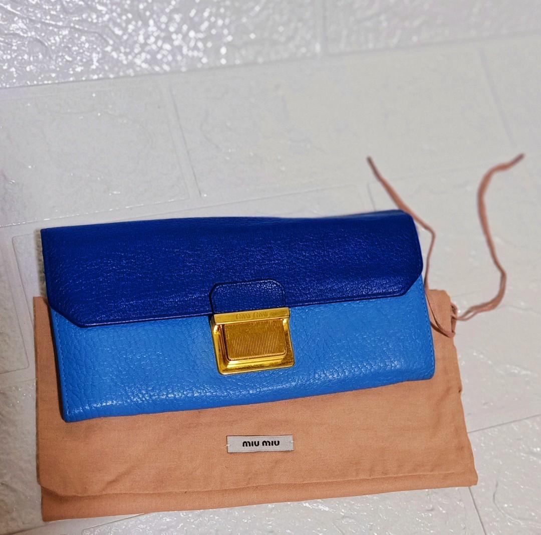 AUTHENTIC MIU MIU MADRAS TWO TONE LONG WALLET (Category: Luxury Bags & Wallets) located in La Trinidad. Submitted by xef06 (Listing ID 1123115654, Image 1). Description: in very good use condition lampo underzip gold hardwares very nice orig.