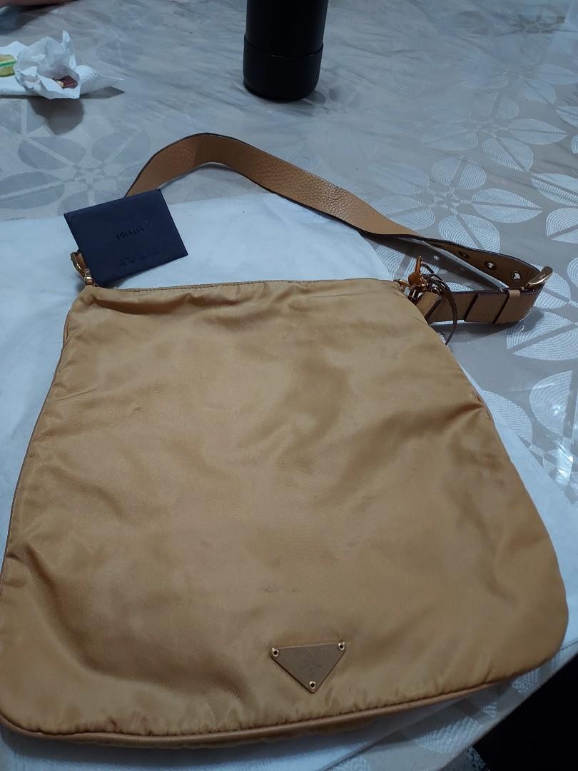 Prada Nylon Shoulder Bag (Category: Luxury Bags & Wallets) located in Paranaque City. Submitted by andim8 (Listing ID 1123053700, Image 1). Description: Authentic prada nylon sboulder bag in honey color. with auth card clochette padlock and keys. provided dustbag only. guaranteed authentic.