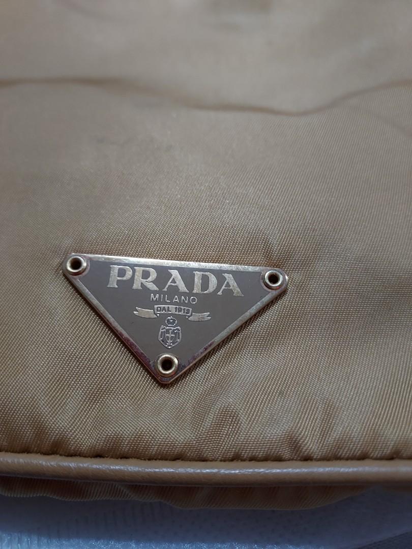 Prada Nylon Shoulder Bag (Category: Luxury Bags & Wallets) located in Paranaque City. Submitted by andim8 (Listing ID 1123053700, Image 2). Description: Authentic prada nylon sboulder bag in honey color. with auth card clochette padlock and keys. provided dustbag only. guaranteed authentic.