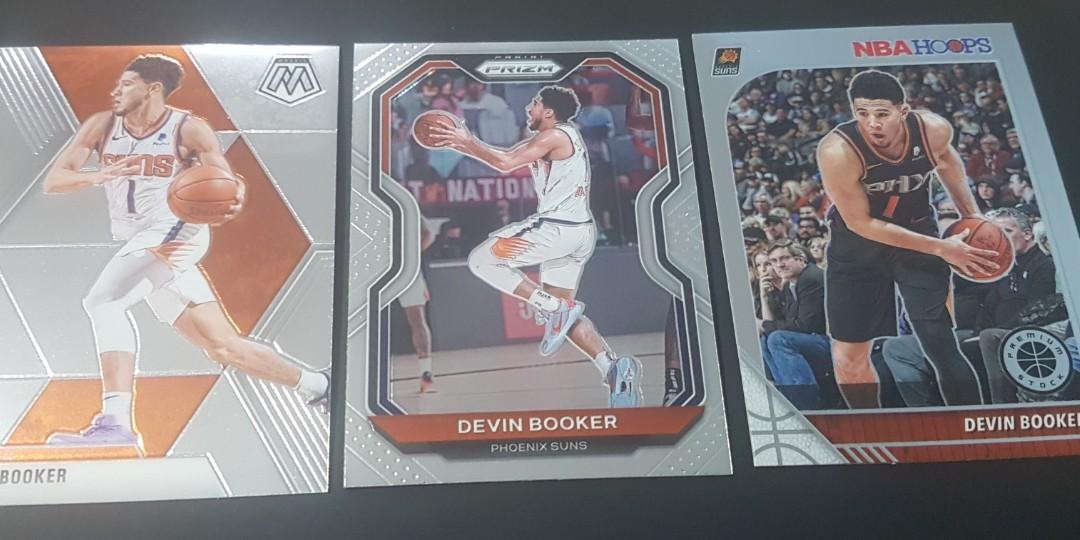 Devin Booker Cards (Category: Raw Singles) located in Pasig City. Submitted by MaryandXaviersCorner (Listing ID 1124910484, Image 1). Description: Devin Booker Cards Selling as lot, total of 3 cards Prizm, Hoops Premium, and Mosaic Actual pictures of the items posted Will be shipped in toploaders and bubblewrap Please check my other NBA cards listings..