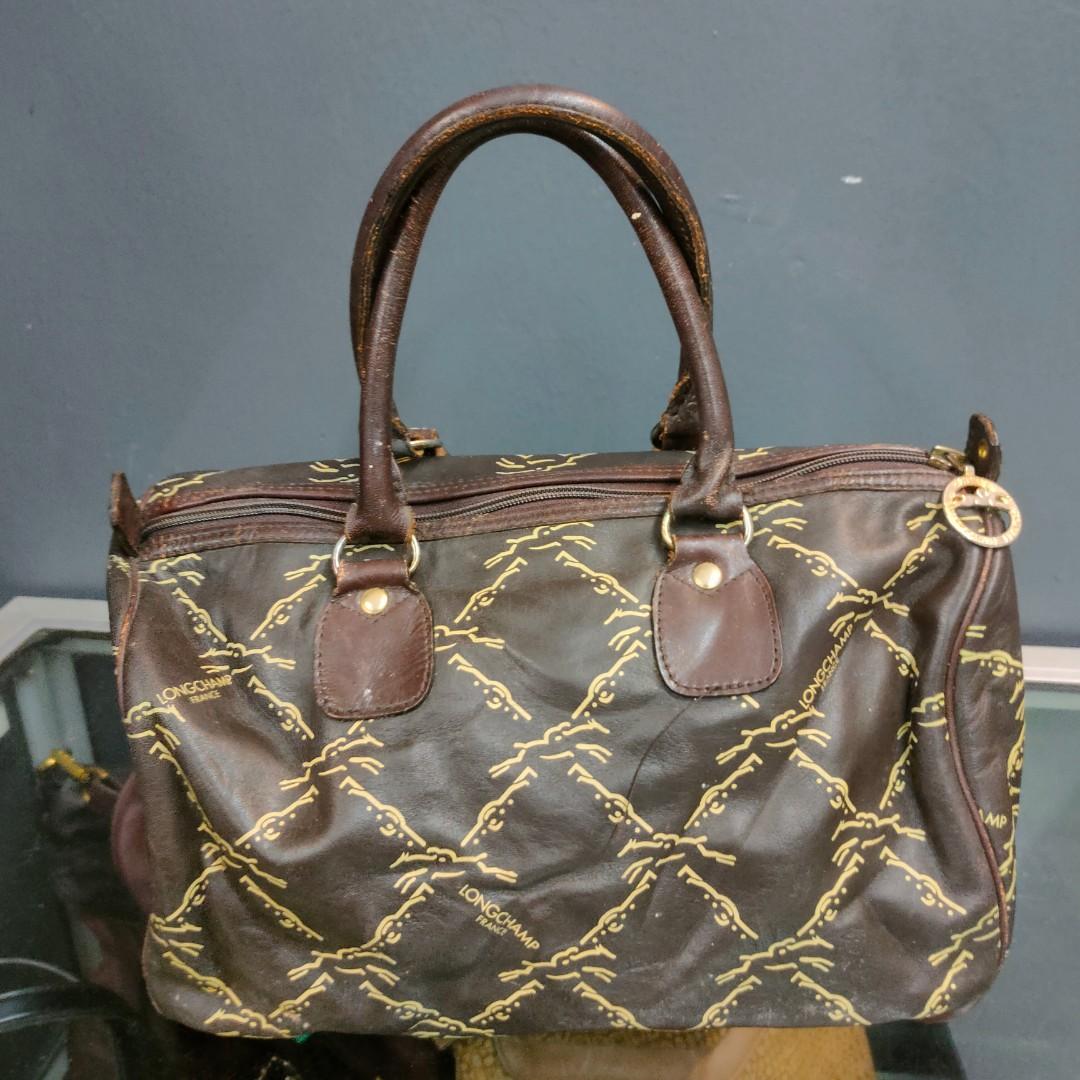 Longchamp vintage speedy signature bag IDR 1jt Size 33x24x18 Warna dark  brown motif longchamp Full leather Keren dan mewah Bag only