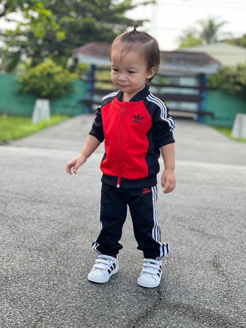 Baby wearing deals adidas tracksuit