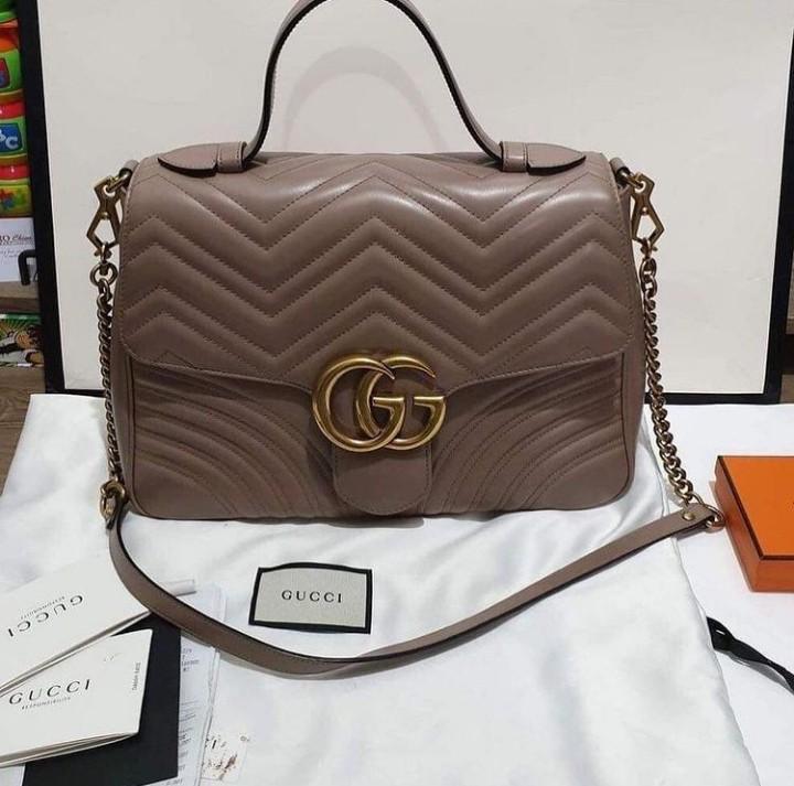 Gucci Quilted Leather Marmont Medium Top Handle Bag (Category: Luxury Bags & Wallets) located in Manila. Submitted by bagislifeshop (Listing ID 1125257444, Image 1). Description: never used Bought 179k.