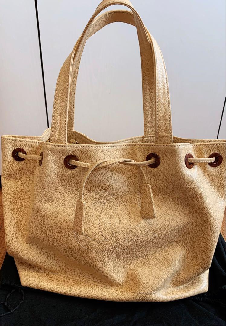 💯% Authentic Chanel Black & Beige Aged Calfskin Drawstring Bucket Bag,  Luxury, Bags & Wallets on Carousell