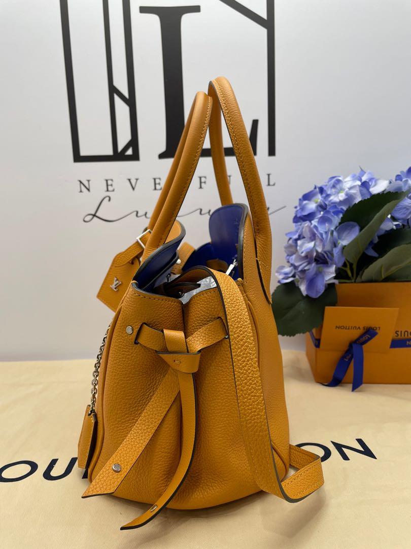 Sold at Auction: Louis Vuitton, Louis Vuitton, Milla PM Saffron Bag