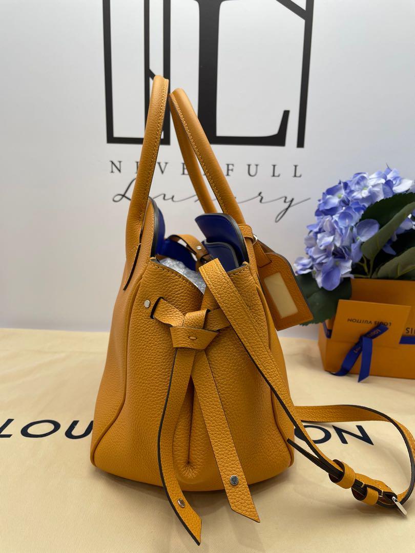 Sold at Auction: Louis Vuitton, Louis Vuitton, Milla PM saffron