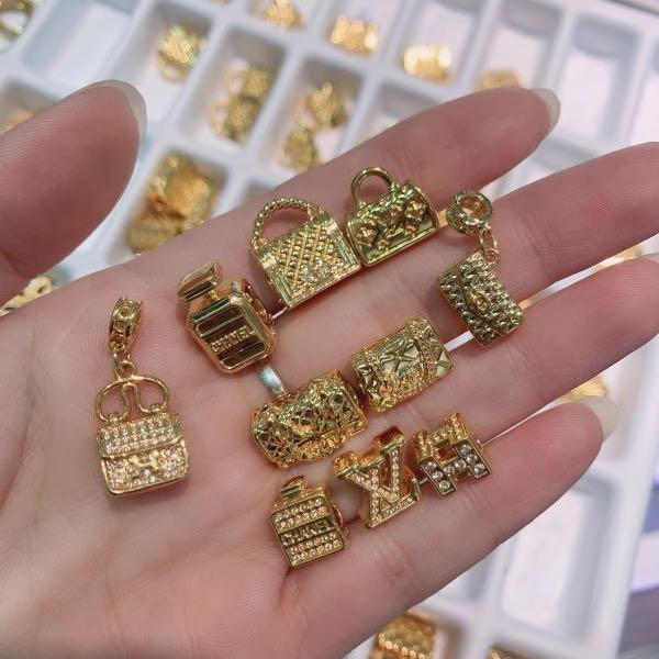 Gold bag charm discount