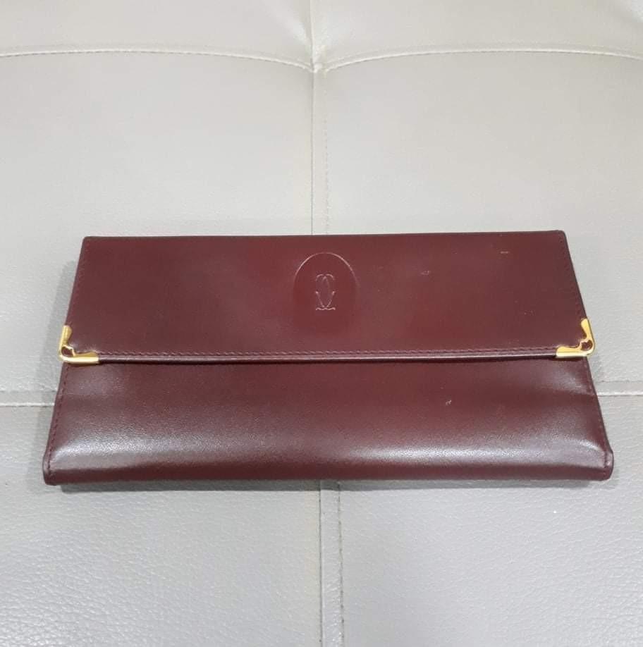 Cartier Tri Fold Long Wallet (Category: Luxury Bags & Wallets) located in Taguig. Submitted by esa.agustin (Listing ID 1126036976, Image 1). Description: Original Cartier maroon tri fold long wallet. In very good condition. With authenticity card..
