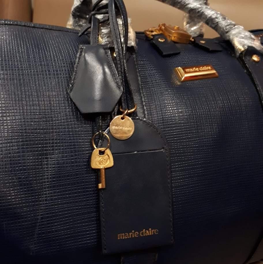 Marie Claire Tavel Bag With Sling (Category: Luxury Bags & Wallets) located in Taguig. Submitted by esa.agustin (Listing ID 1125964944, Image 2). Description: Original Marie Claire blue leather travel.bag. With original slng, hangtag, lock and key..