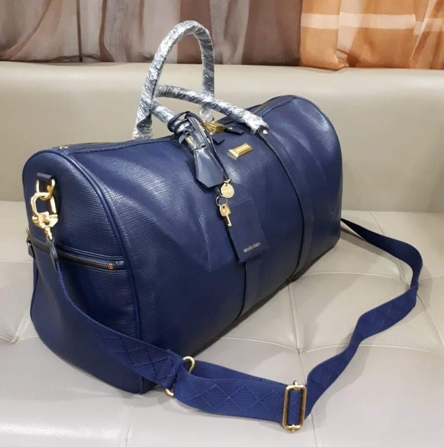 Marie Claire Tavel Bag With Sling (Category: Luxury Bags & Wallets) located in Taguig. Submitted by esa.agustin (Listing ID 1125964944, Image 1). Description: Original Marie Claire blue leather travel.bag. With original slng, hangtag, lock and key..