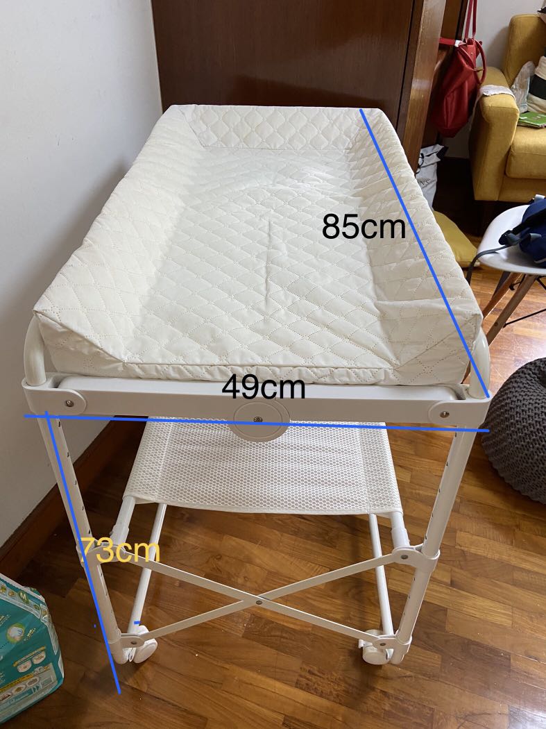 Compact changing table with lockable wheels, Babies & Kids, Bathing