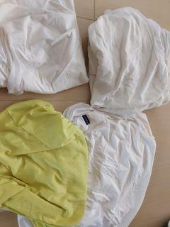 Cot mattress protector and bedsheet