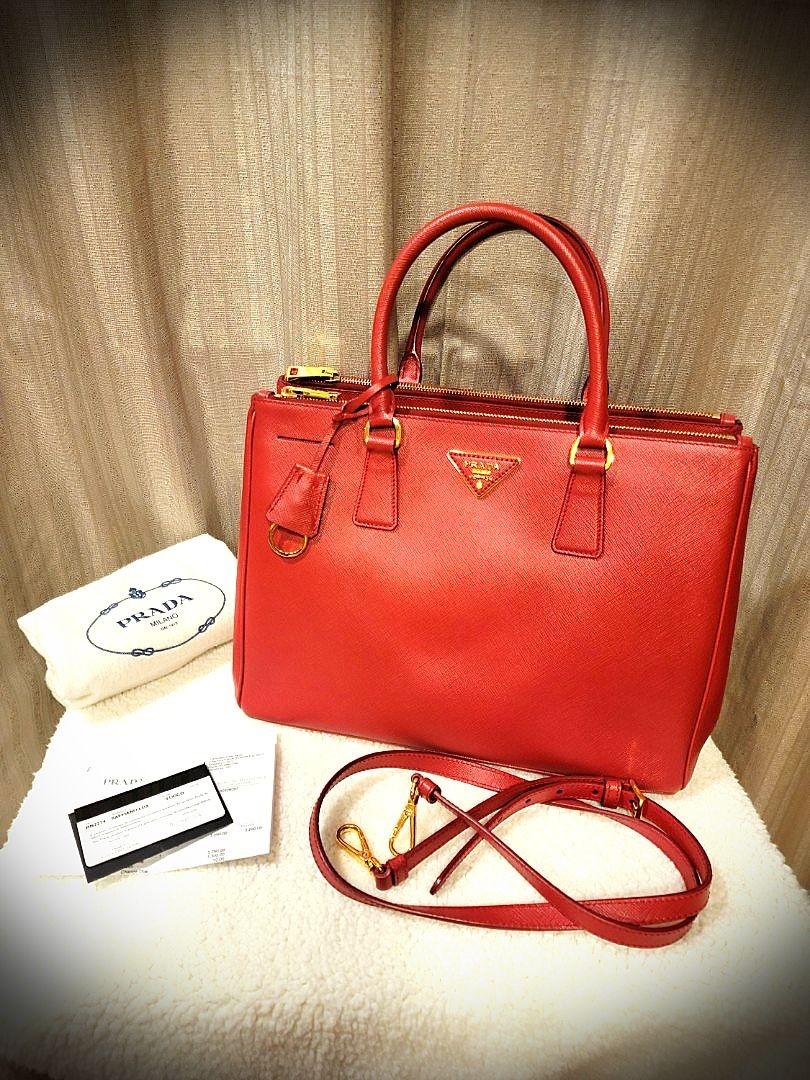 PRADA Saffiano Lux Double Zip (Category: Luxury Bags & Wallets) located in Quezon City. Submitted by travelali (Listing ID 1020023202, Image 1). Description: one of Prada's classic bag that will never go out of style. 3 way to wear, handbag shoulder bag crossbody! used less than 5x. bought in Prada Singapore. photocopy of receipt will be given. last photo for peg from web.