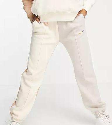Nike Metallic Swoosh colour block joggers in cream and grey