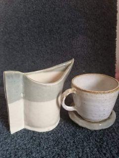 Stoneware Cup and Saucer and a small Pitcher