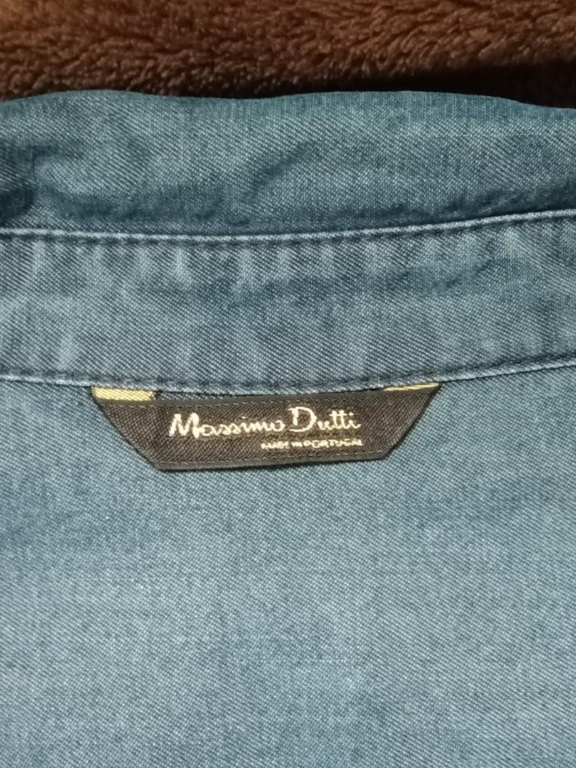 Denim Polo button up Mossimo Dutti (Women's) (Category: Longsleeves) located in Quezon City. Submitted by yellowcorner_store (Listing ID 1127541322, Image 3). Description: made in Portugal size: XL measurements: length - 28" bust - 42" sleeves length - 25" minor issue: small hole Infront (see photo).