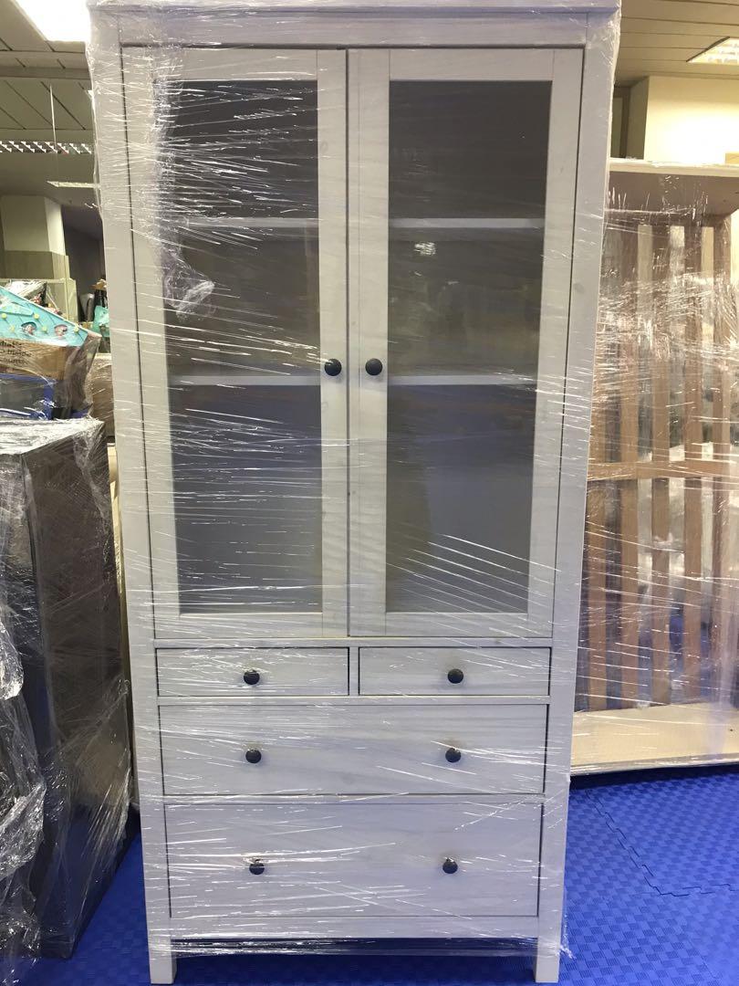 IKEA wellloved white wood bookshelf with drawers and glass