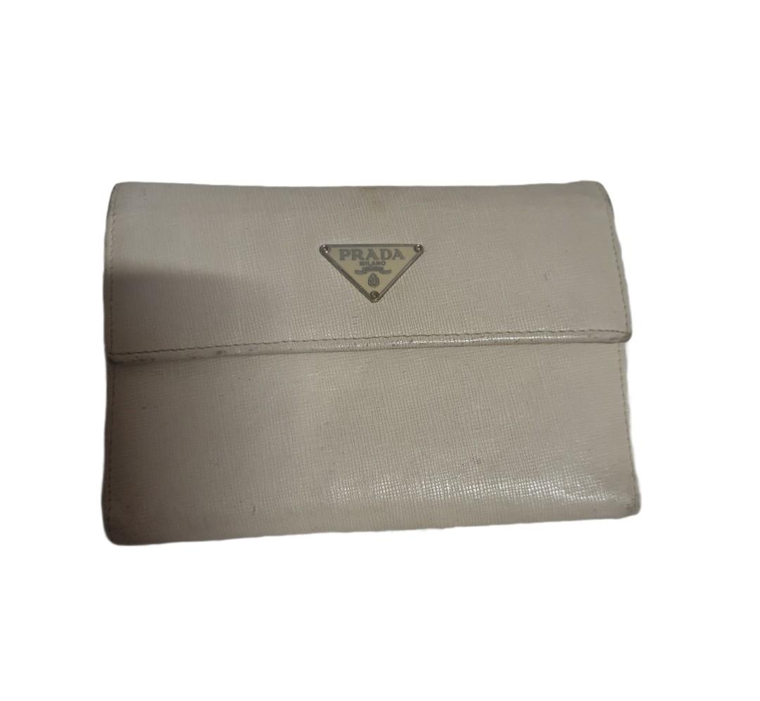 🌸 PRADA Off White Medium Wallet 🌸 (Category: Luxury Bags & Wallets) located in Bulacan. Submitted by saturday.ph (Listing ID 1128283129, Image 1). Description: Gently used. Well loved. 💕 RANK AB MADE IN ITALY.