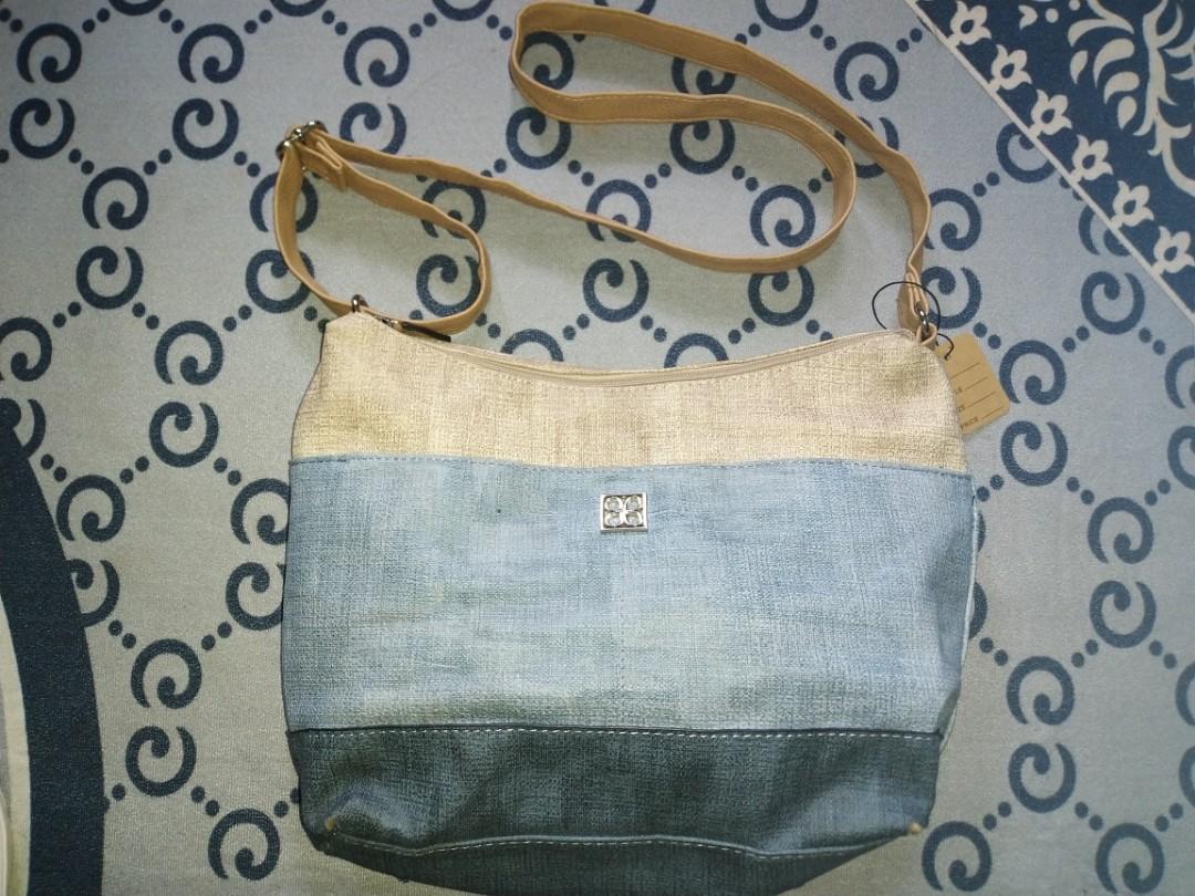 Cabrelli sling hotsell bag
