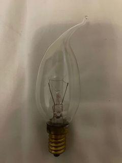 Candle shaped filament light bulb