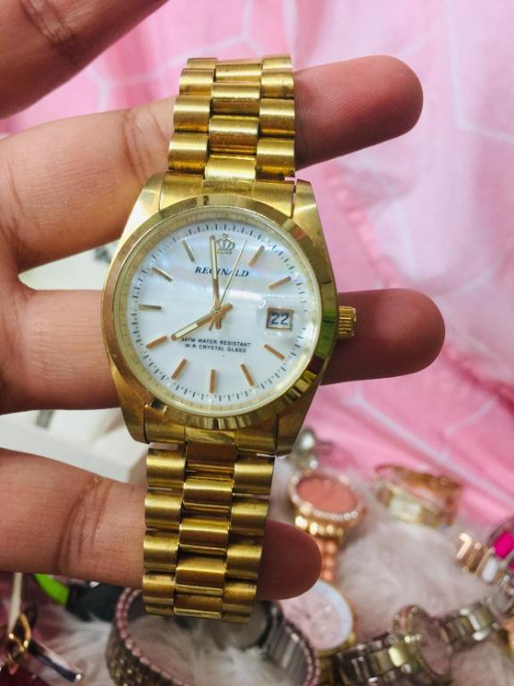 Reginald gold watch top