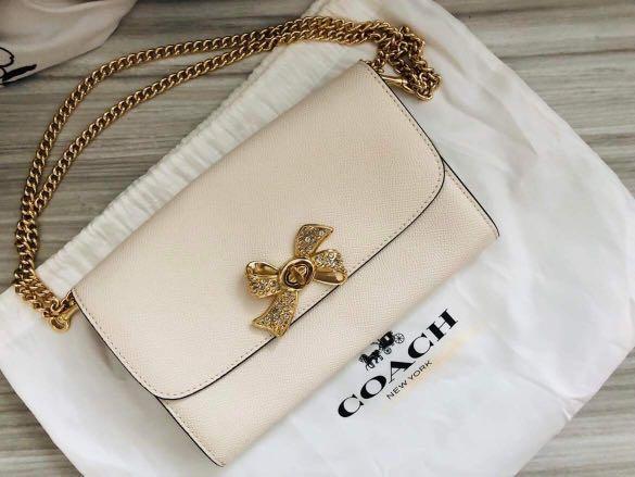 Coach wallet on chain ribbon bow white crossbody gold chain bag woc,  Women's Fashion, Bags & Wallets, Cross-body Bags on Carousell