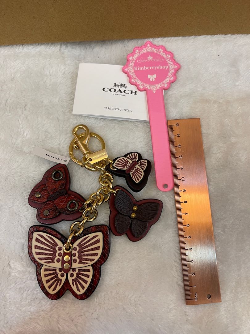 Authentic Coach Keychain 1674 BUTTERFLY CLUSTER BAG CHARM Women s Fashion Jewelry Organisers Necklaces on Carousell