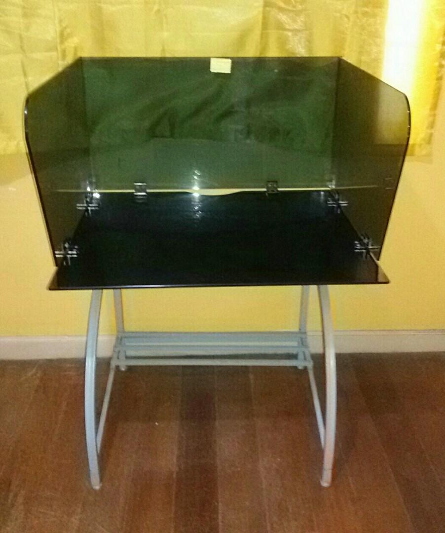 GLASS TABLE (tempered glass, multipurpose) (Category: Tables & Sets) located in Pasig City. Submitted by kuhkuh (Listing ID 1123331998, Image 2). Description: MULTI-PURPOSE GLASS TABLE (computer, study, office table) 2 - unit available ~ Available until posted ~ Thick tempeted glass (5mm), Glass removable Minor flaw> slightly rusty metal frame (u can repaint) Marked-down price (sale price - fix price) Original price 1,500.+/each Height : 130cm Le