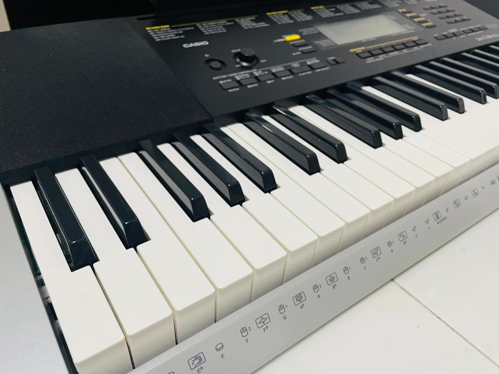 Casio Digital Keyboard CTK 4400 with X stand and song books