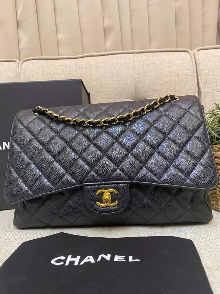 Chanel Maxi Black Caviar Single Flap GHW (Category: Luxury Bags & Wallets) located in Manila. Submitted by bagislifeshop (Listing ID 1123520825, Image 3). Description: Woot Woot!!!! Good Deal 🖤🖤🖤 100% Authentic Chanel Maxi Black Caviar Single Flap GHW Series 13xxxxxxxx Condition 8/10 Comes with Box Dustbag Entrupy Certificate and Hologram Intact.