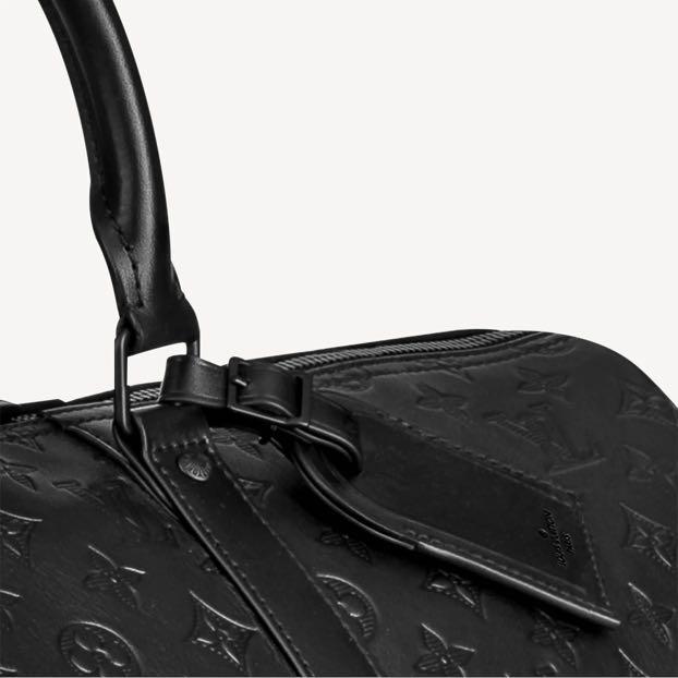 Black and white sales louis vuitton duffle bag