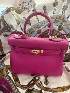 Pink top handle leather bag