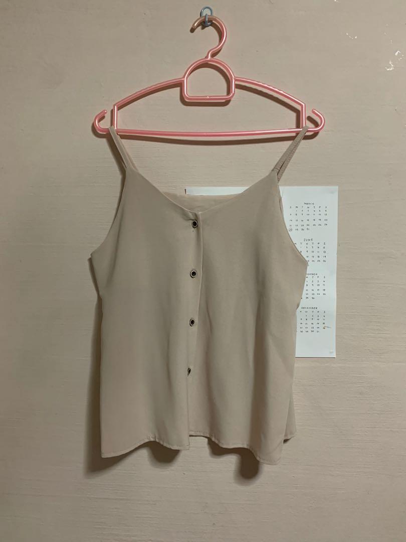 Spaghetti Strap Button Top (Category: Sleeveless) located in Singapore. Submitted by humble_wardrobe (Listing ID 1123587921, Image 1). Description: PTP - 17 inch Length - 20 inch Strap length - 37.5 inch.