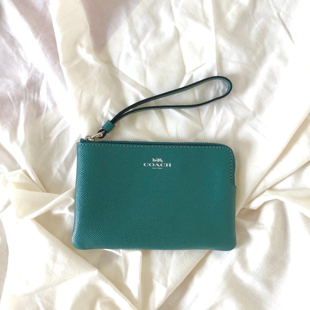COACH Corner Zip Wristlet (Green) (Category: Purses & Pouches) located in San Mateo. Submitted by PSfinds_declutters (Listing ID 1123783524, Image 1). Description: Goods from Canada 🇨🇦 *See photos for details. - Shipped and Arrived thru AXP. - Brand New, Original and Authentic items from Canada. - All products are much affordable because we bought it from sale. - All products are onhand unless marked sold. - Feel free to message us if you want 