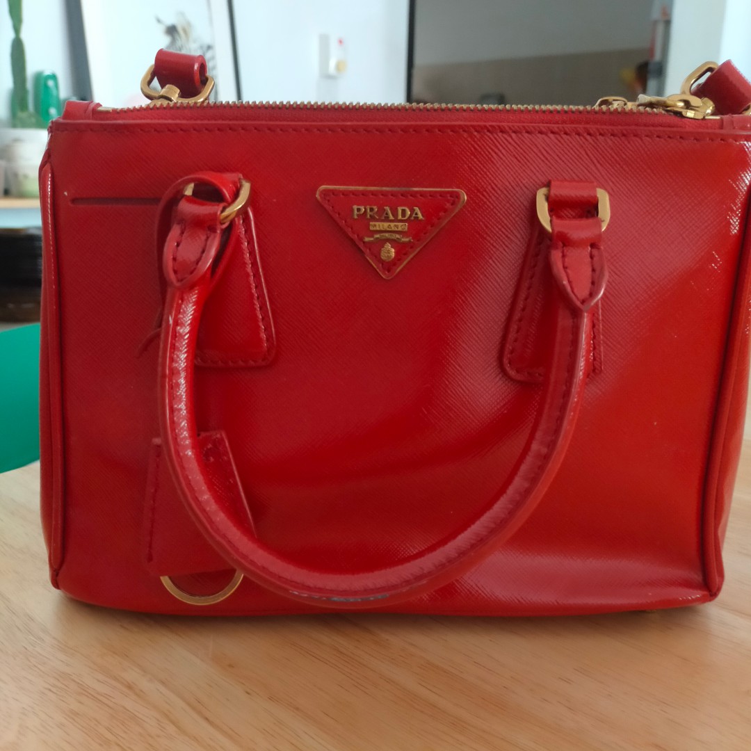 Prada Saffiano small red bag, Luxury, Bags & Wallets on Carousell