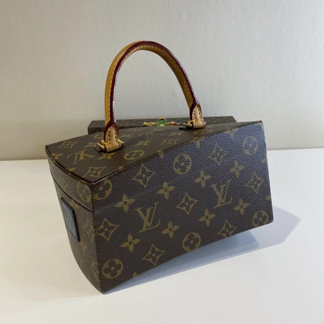 A LIMITED EDITION ICONOCLAST MONOGRAM CANVAS TWISTED BOX WITH GOLD