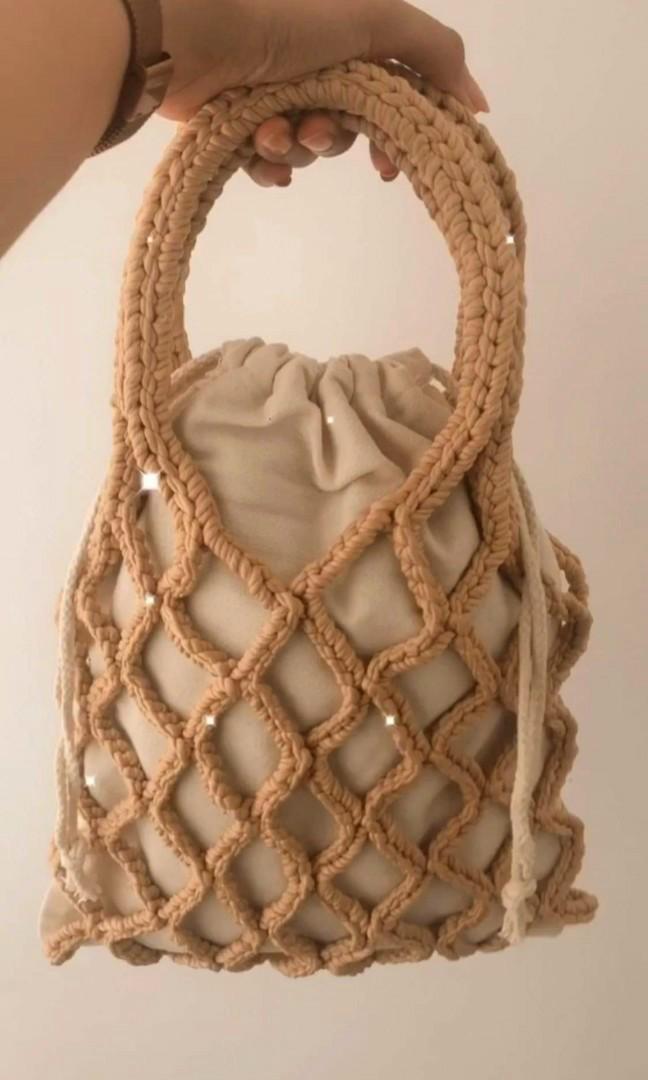 Crochet Macrame Net Bag (Category: Beach Bags) located in Calumpit. Submitted by dollhouserendering (Listing ID 1124007931, Image 1). Description: New style net beach bag Perfect for your summer OOTD Inner pouch: 10"(w)x12"(h) Net bag: approximately 11"(w)x16"(h) iba na yung yarn na ginamit ko dito and with canvas bag for inner lining LIMITED STOCKS konti lang kasi kaya kong gawin. MACHINE WASHABLE mode of payment BDO GCASH CHINABANK or SHOPEE.