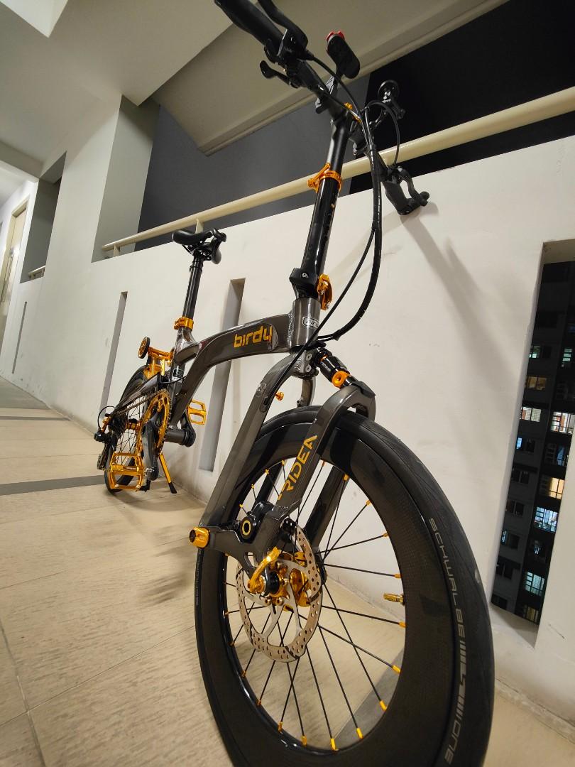 Fully upgraded Birdy R20 (Category: Bicycles) located in Singapore. Submitted by echiz3n (Listing ID 1124451027, Image 2). Description: Fully Upgraded/ Customized Birdy R20 from Mighty Velo and Bzcycle Gen 3 Mercury Grey (Premium Color) 1. Praxis Carbon crankarm with BB 2. Magura MT2 3. Shimano Ultegra R8000 RD 4. Shimano Ultegra R8000 Cassette 11-28T 5. KMC X11SL Gold & Black 6. Colorplus BS03 Full suspension 7. Ridea OSPW+ RD6 C35 Gold Jockey W