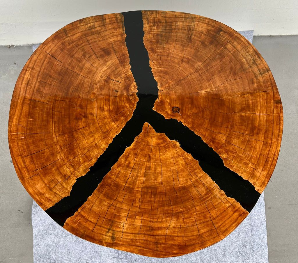Solid wood slice coffee table with black resin art piece, Furniture
