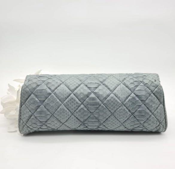 Chanel python clutch (Category: Bags & Wallets) located in Singapore. Submitted by polleny (Listing ID 1124677789, Image 2). Description: Rare exotic piece in a dreamy blue python leather. Instantly glams up your style in an understated way. Used less than 5 times. Bought for $7000. Comes with box, dust bag and authenticity card. Ps: do note that the nature of python leather is soft and flaky. It means seams are not always smooth (like a calf lea