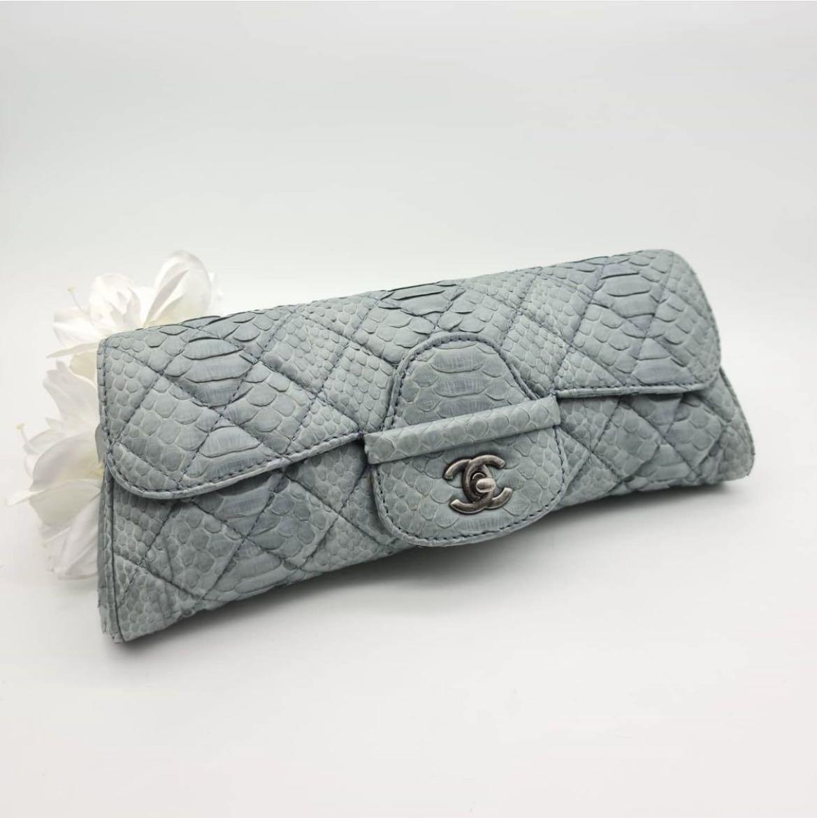Chanel python clutch (Category: Bags & Wallets) located in Singapore. Submitted by polleny (Listing ID 1124677789, Image 1). Description: Rare exotic piece in a dreamy blue python leather. Instantly glams up your style in an understated way. Used less than 5 times. Bought for $7000. Comes with box, dust bag and authenticity card. Ps: do note that the nature of python leather is soft and flaky. It means seams are not always smooth (like a calf lea