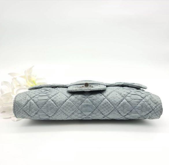 Chanel python clutch (Category: Bags & Wallets) located in Singapore. Submitted by polleny (Listing ID 1124677789, Image 3). Description: Rare exotic piece in a dreamy blue python leather. Instantly glams up your style in an understated way. Used less than 5 times. Bought for $7000. Comes with box, dust bag and authenticity card. Ps: do note that the nature of python leather is soft and flaky. It means seams are not always smooth (like a calf lea